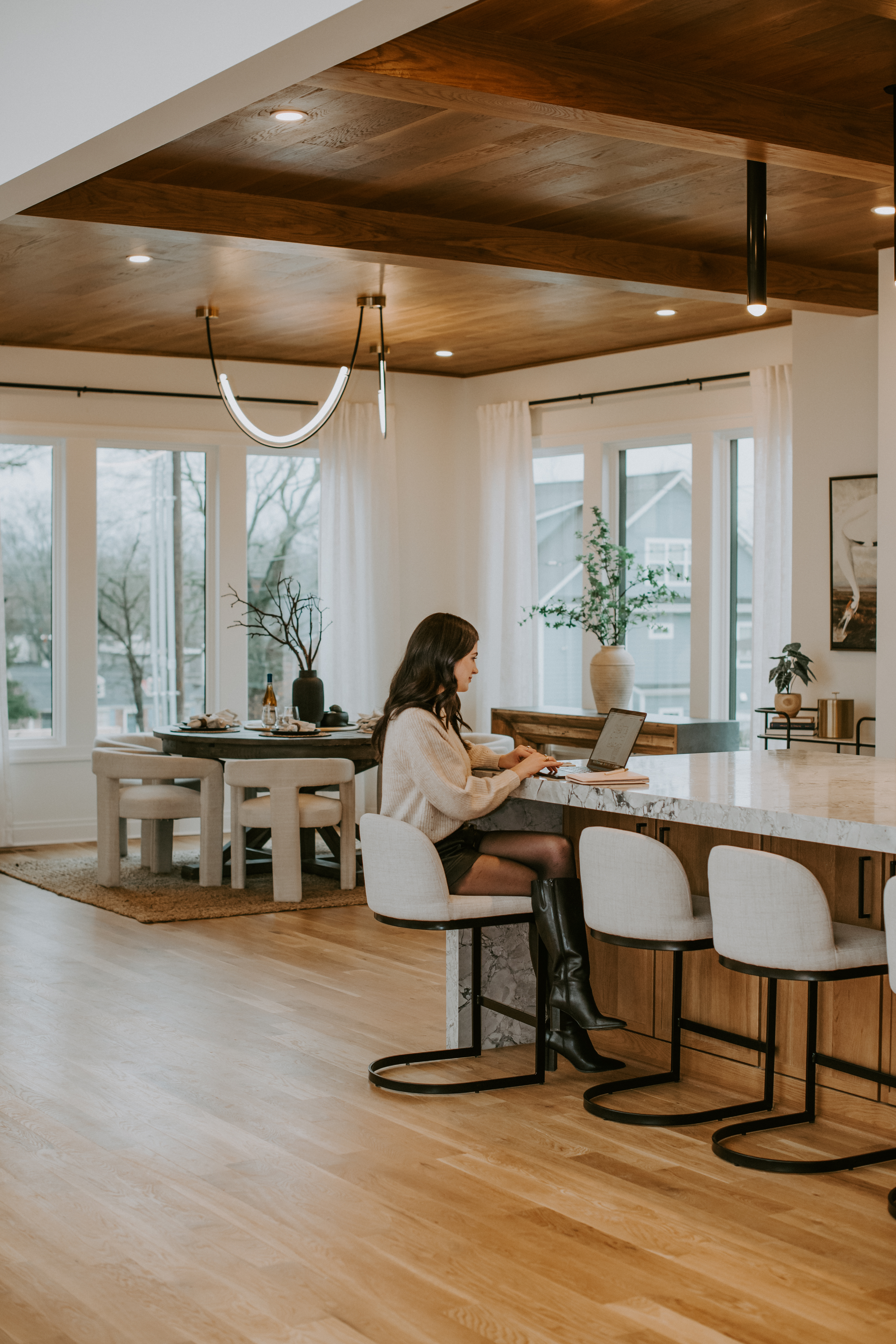 Britt Weiner writing at her kitchen counter